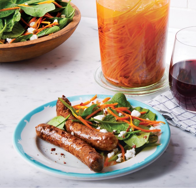 Grilled Merguez Sausages with Baby Spinach, Curried Pickled Carrots & Goat Cheese